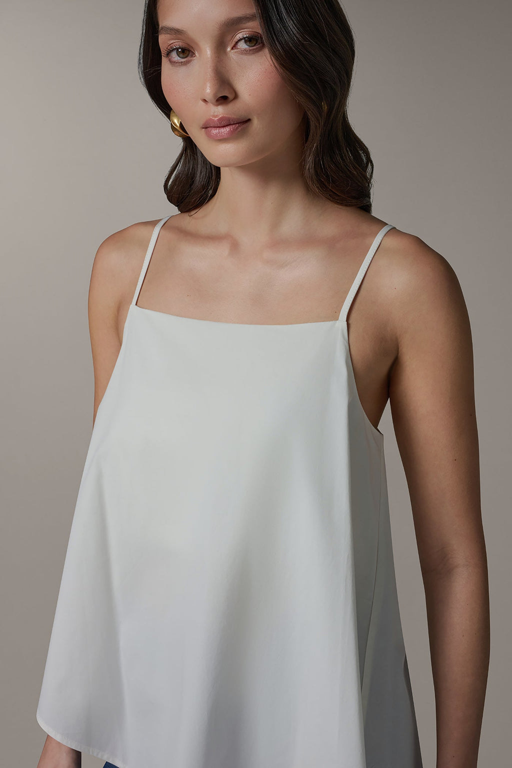 SLEEVELESS ASYMMETRIC TIE BACK BLOUSE