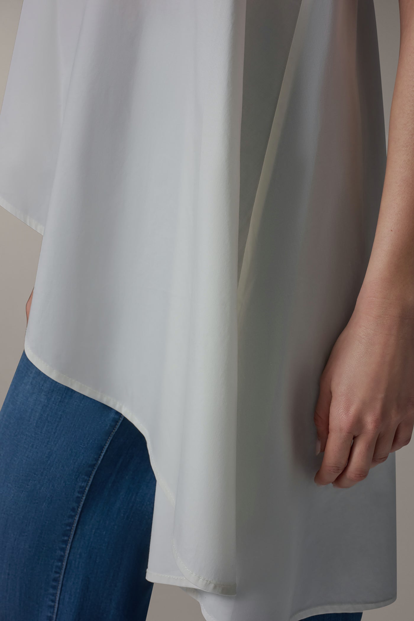 SLEEVELESS ASYMMETRIC TIE BACK BLOUSE